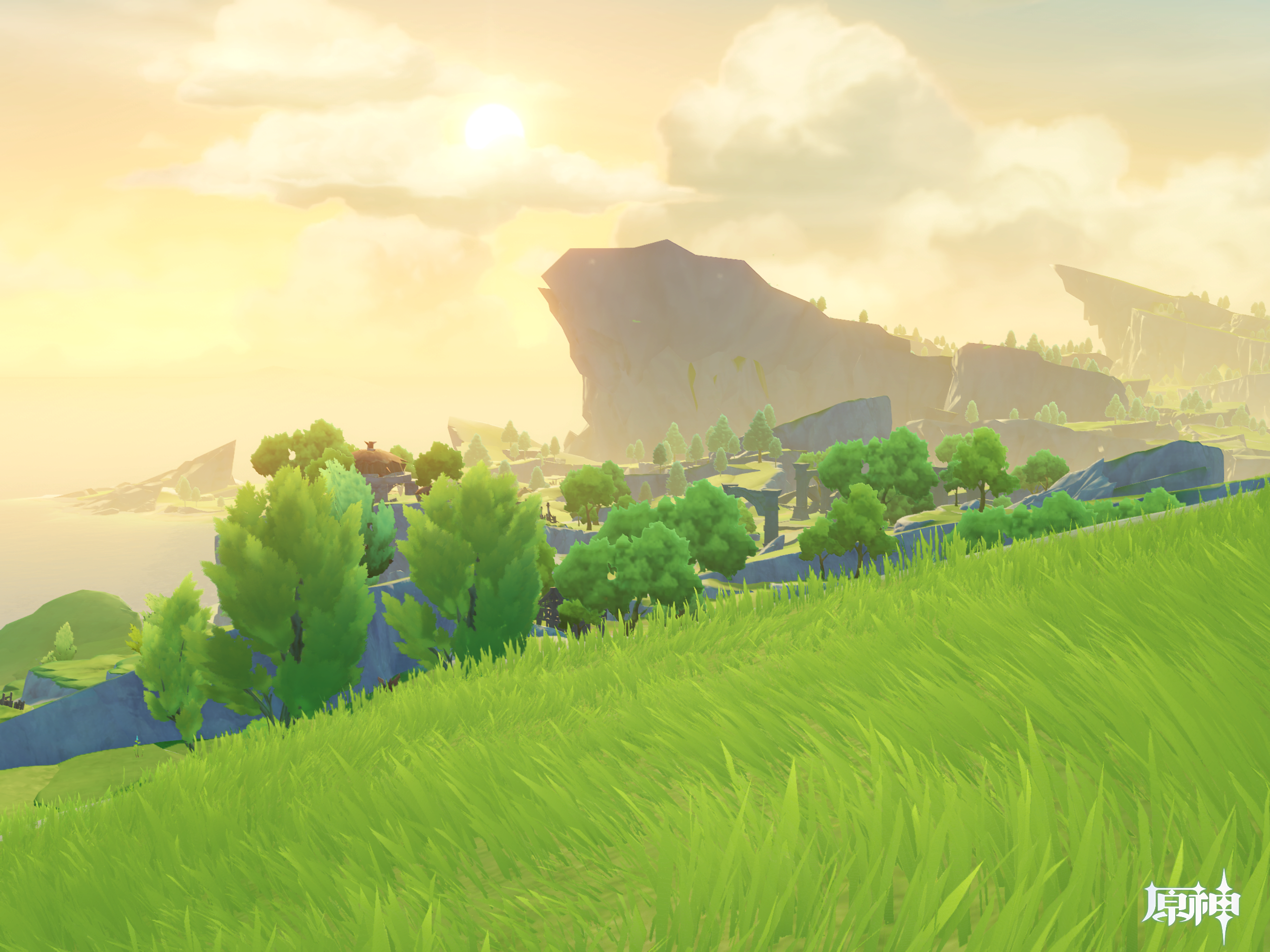 A sunlit landscape shows rolling grassy hills leading toward rocky cliffs and a distant sea under a bright, cloudy sky in a scene from Genshin Impact.